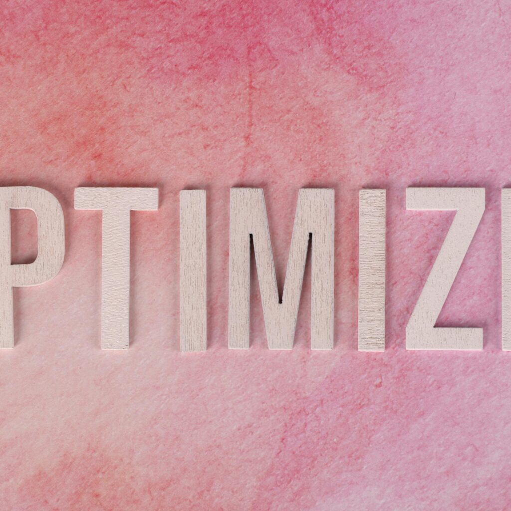 optimize-concept-on-pink-textured-background