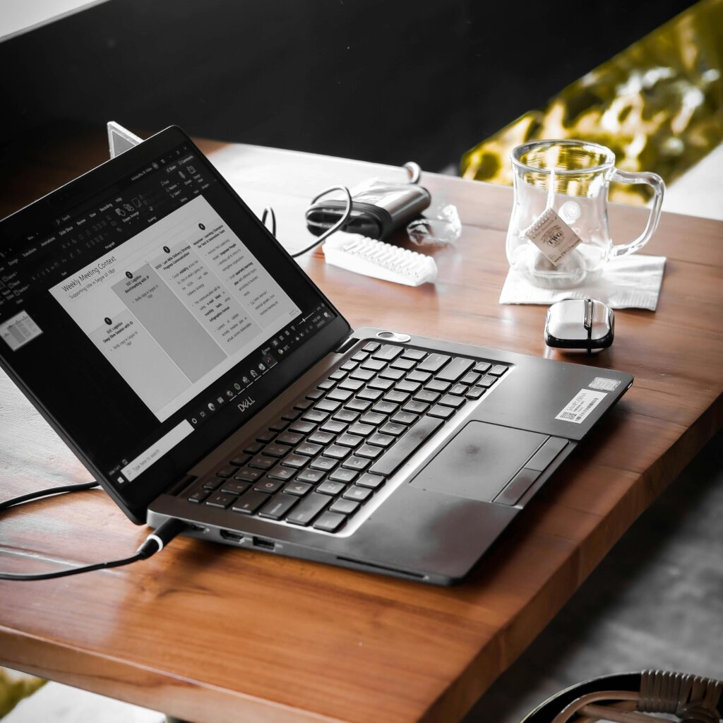 open-laptop-lying-on-coffee-table