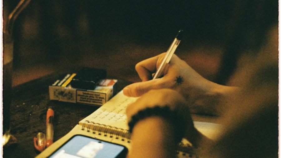 person-writing-on-white-paper